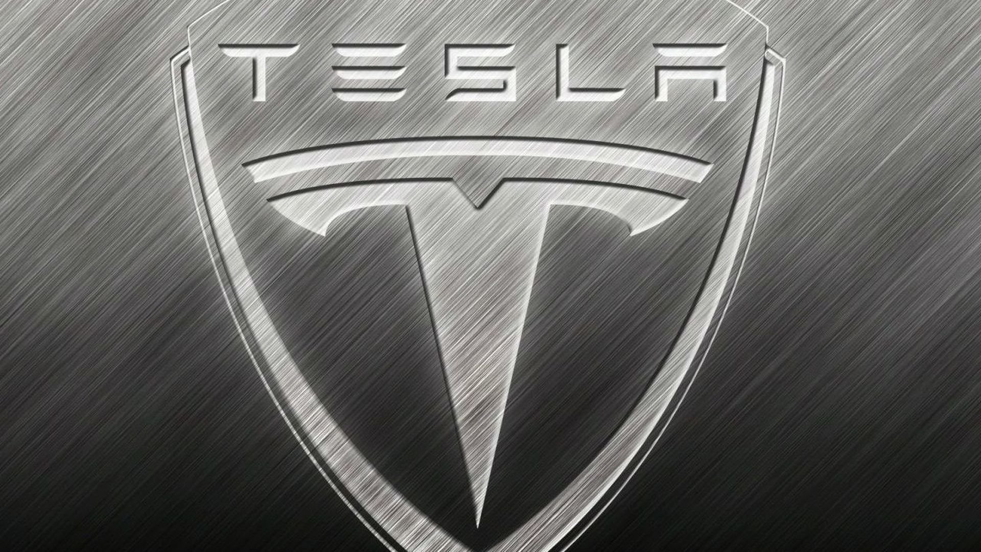 Знак теслы на машине. Tesla марка машины. Значки автомобилей. Значок Tesla на машине. Значок марки автомобиля Тесла.