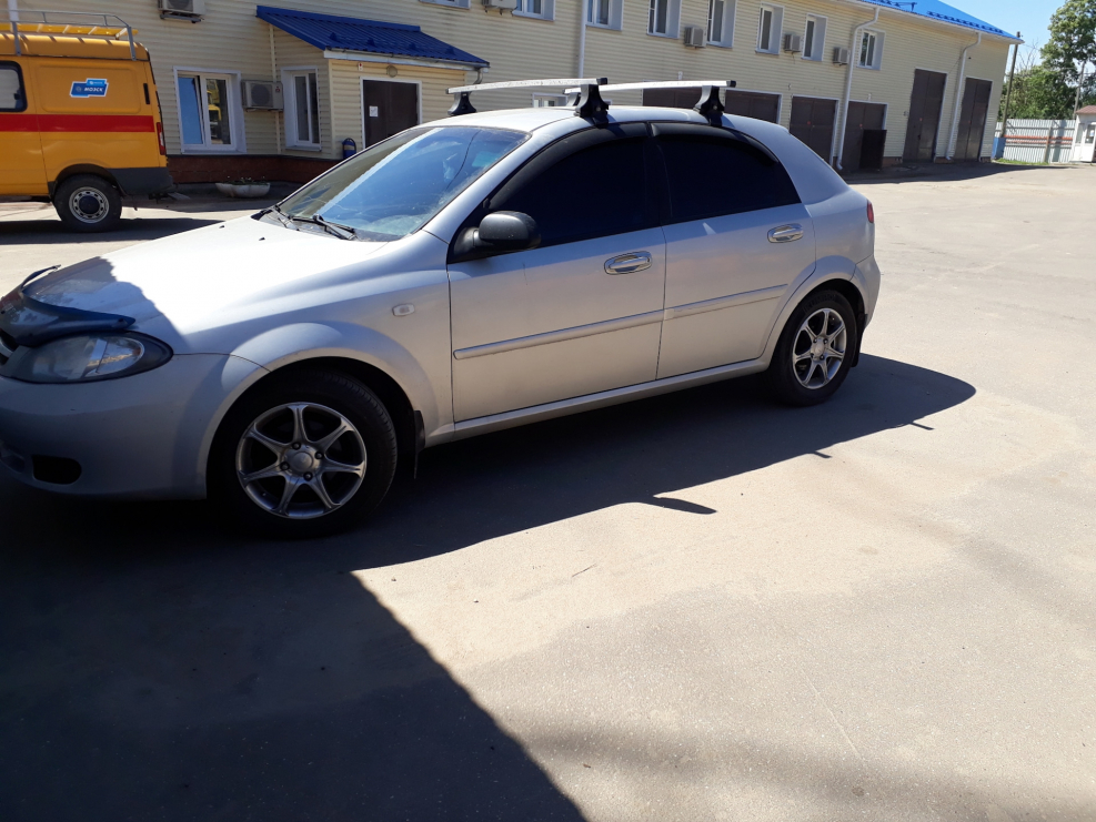 Белая Шевроле Авео т 300 тонированная