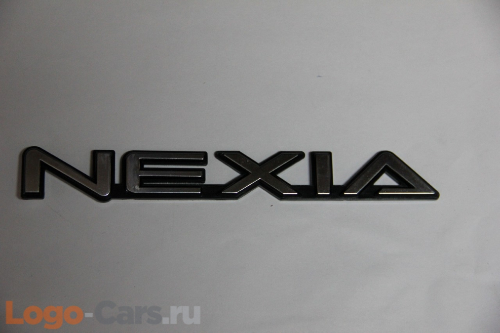 Nexia надпись
