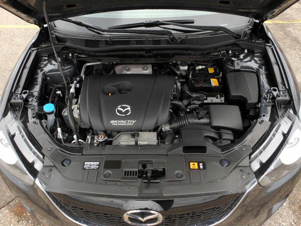 Двигатель мазда сх 5 2.5. Mazda CX 5 под капотом. Mazda CX-7 подкапотное пространство. Mazda CX 5 подкапотное пространство. Моторный отсек Мазда сх5.
