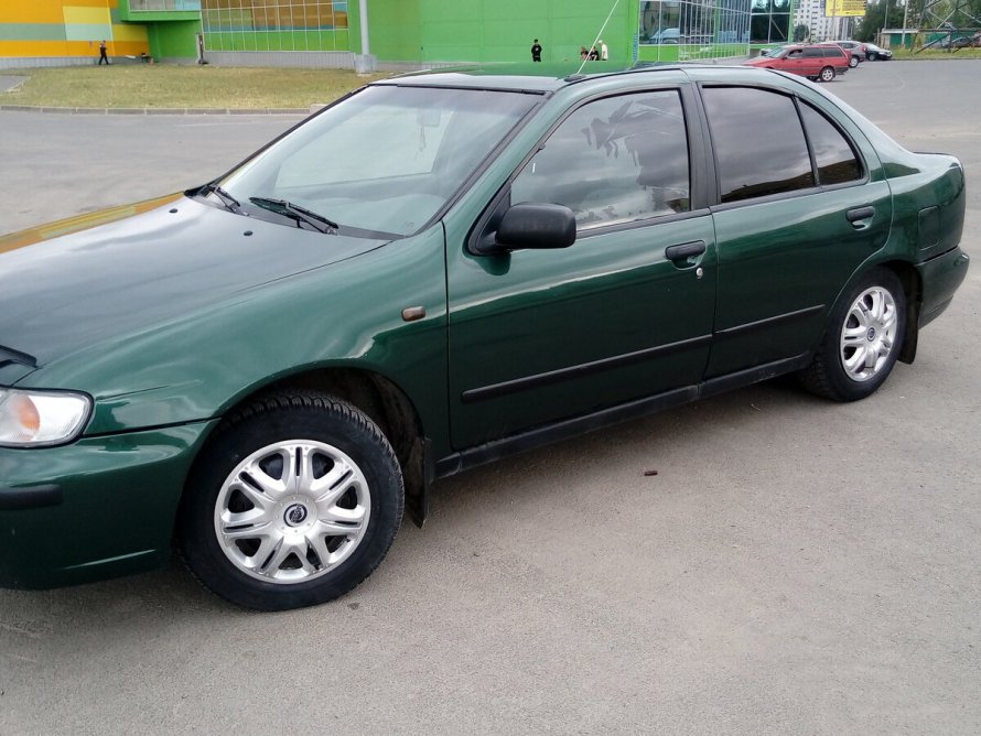 Nissan Almera n15 зелёный седан