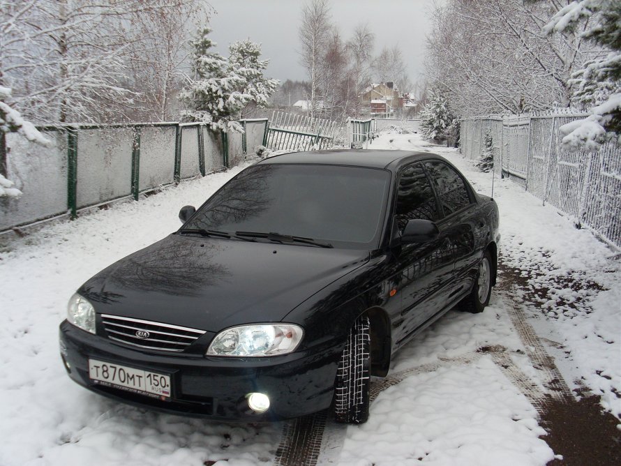 Kia Spectra черная тонированная
