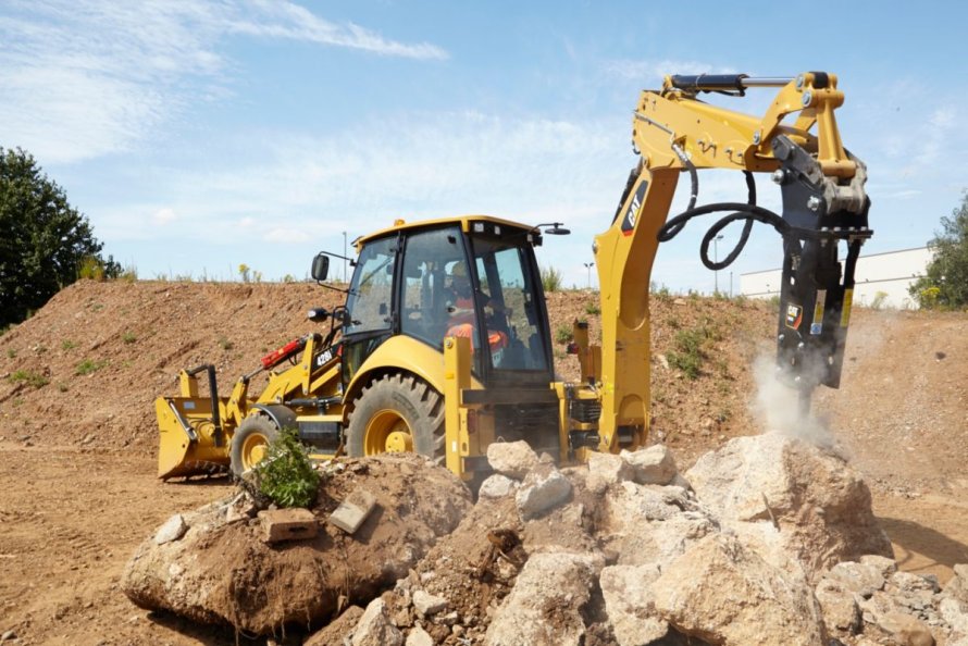 Caterpillar 428e с гидромолотом