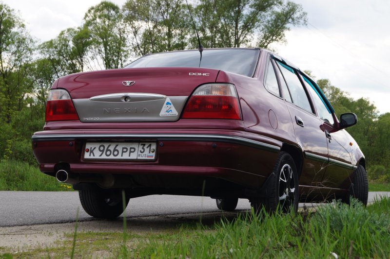 Белая Нексия 100