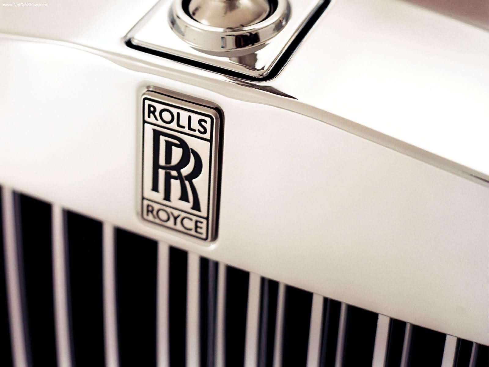 Роллс промокод. Марка Роллс Ройс. Роллс Ройс лого. Машина Роллс Ройс значок. Rolls Royce Phantom значок.