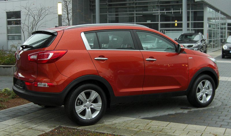 Kia Sportage 2012 оранжевая вид с боку фото