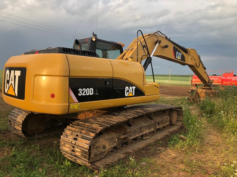 Экскаватор-погрузчик Caterpillar 440